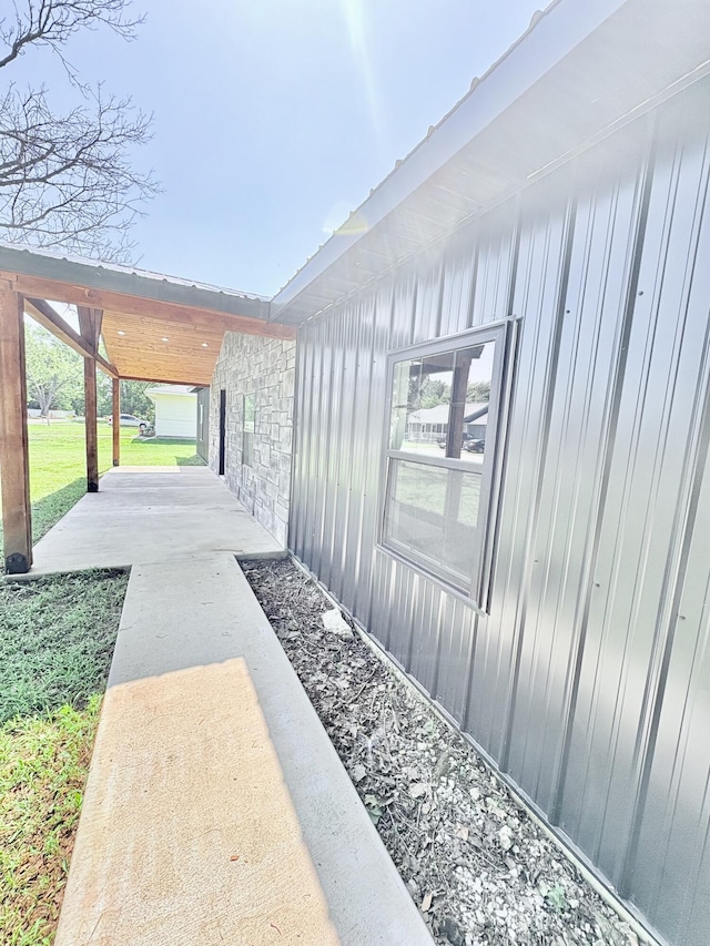 401 E 17th St, Lockwood, MO 65682 - property entrance featuring board and batten siding, a patio, and stone siding