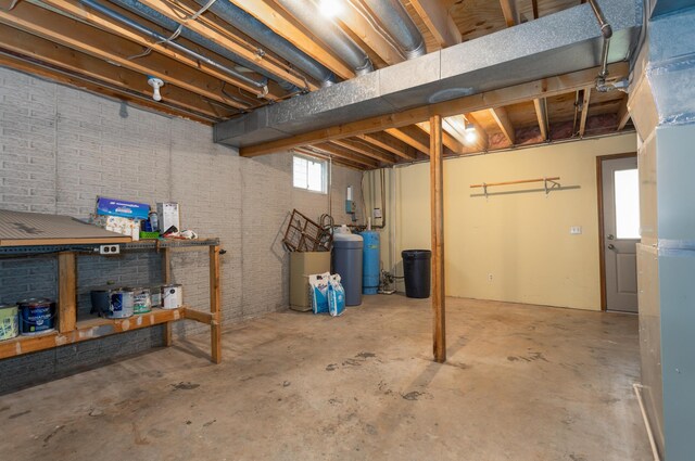 6337 S Farm Road 31, Billings, MO 65610 - basement featuring brick wall and a water softener system