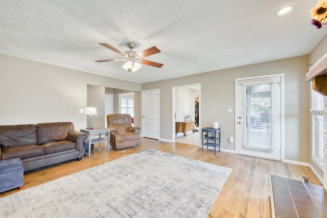 3477 W Broadmoor Ct, Springfield, MO 65807 - living room with a textured ceiling, ceiling fan, wood finished floors, and recessed lighting