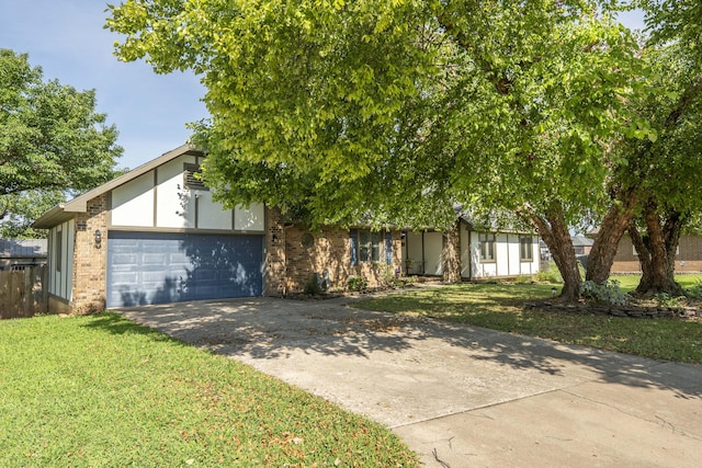 3477 W Broadmoor Ct, Springfield, MO 65807 - view of front of home with concrete driveway, a garage, and brick siding