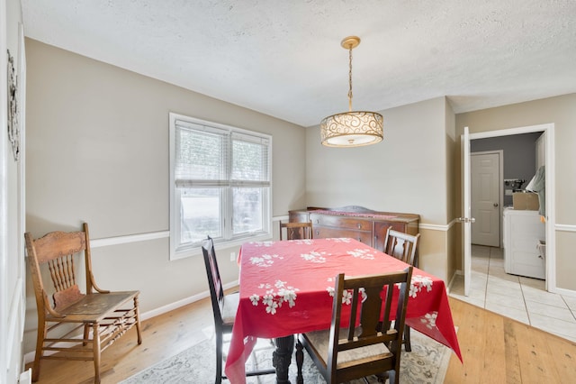 3477 W Broadmoor Ct, Springfield, MO 65807 - dining space with light wood-style floors and a textured ceiling