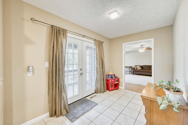 3477 W Broadmoor Ct, Springfield, MO 65807 - doorway to outside with a textured ceiling, light tile patterned floors, french doors, and a ceiling fan