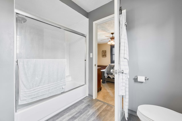 3477 W Broadmoor Ct, Springfield, MO 65807 - ensuite bathroom with wood finished floors, shower / bath combination with glass door, and ceiling fan