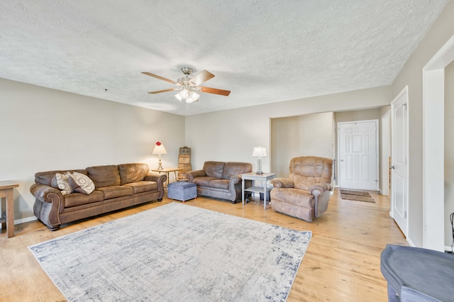 3477 W Broadmoor Ct, Springfield, MO 65807 - living area with ceiling fan, a textured ceiling, and light wood finished floors