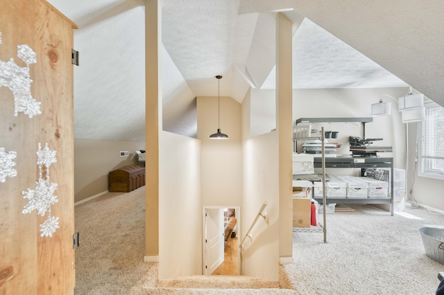 3477 W Broadmoor Ct, Springfield, MO 65807 - hallway with carpet, a textured ceiling, lofted ceiling, and an upstairs landing