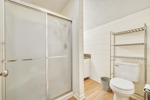 3477 W Broadmoor Ct, Springfield, MO 65807 - bathroom with wood finished floors and a shower stall