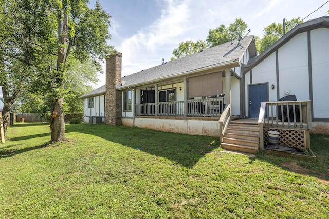 3477 W Broadmoor Ct, Springfield, MO 65807 - rear view of house featuring a chimney, a deck, and a shingled roof