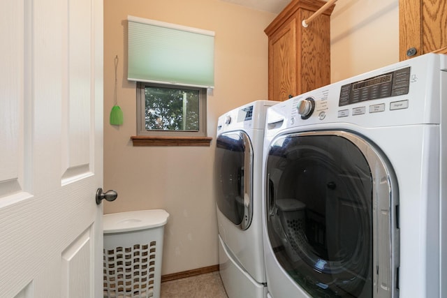 360 Durango Ln, Billings, MO 65610 - washroom featuring cabinet space, washing machine and clothes dryer, and tile patterned flooring