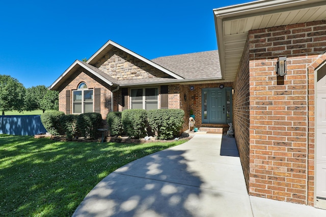 360 Durango Ln, Billings, MO 65610 - entrance to property featuring brick siding, a lawn, and roof with shingles