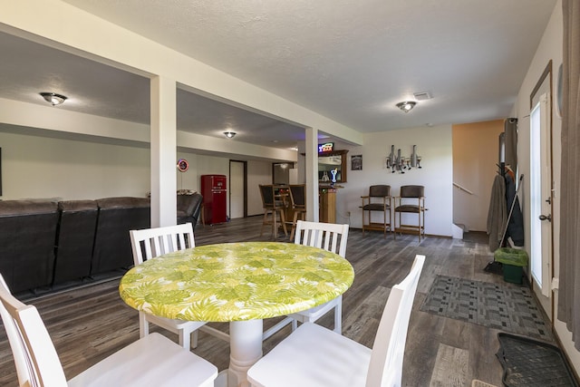 360 Durango Ln, Billings, MO 65610 - dining area with wood finished floors and a textured ceiling