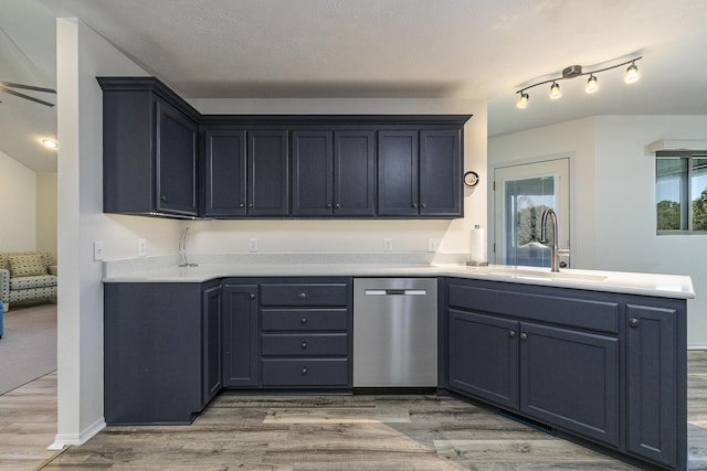 360 Durango Ln, Billings, MO 65610 - kitchen featuring dishwasher, light wood finished floors, a peninsula, and light countertops