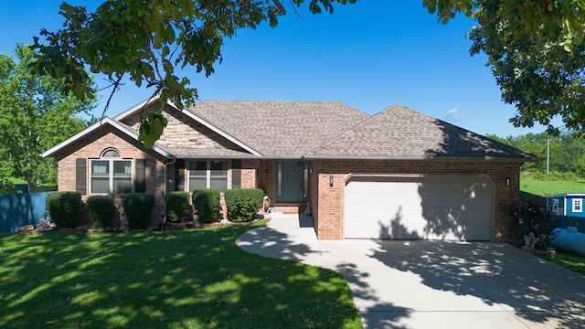 360 Durango Ln, Billings, MO 65610 - view of front of house featuring an attached garage, brick siding, concrete driveway, a front yard, and a shingled roof