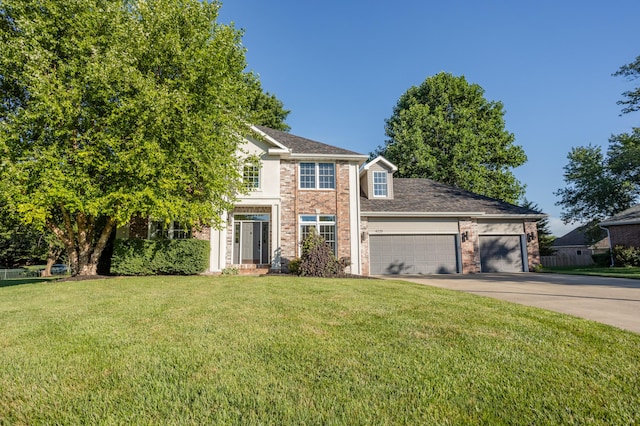 4225 E Crosswinds Pl, Springfield, MO 65809 - view of front of home featuring a garage, concrete driveway, a front yard, and brick siding