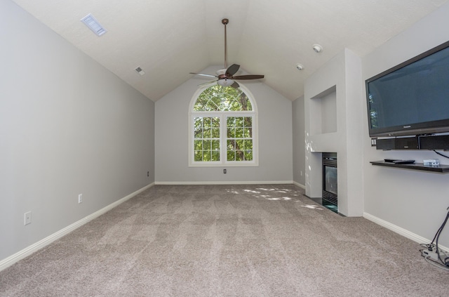 4225 E Crosswinds Pl, Springfield, MO 65809 - unfurnished living room featuring carpet floors, ceiling fan, lofted ceiling, and a fireplace with flush hearth