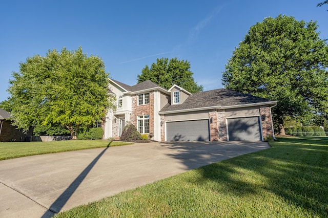 4225 E Crosswinds Pl, Springfield, MO 65809 - view of front of home with brick siding, concrete driveway, and a front yard