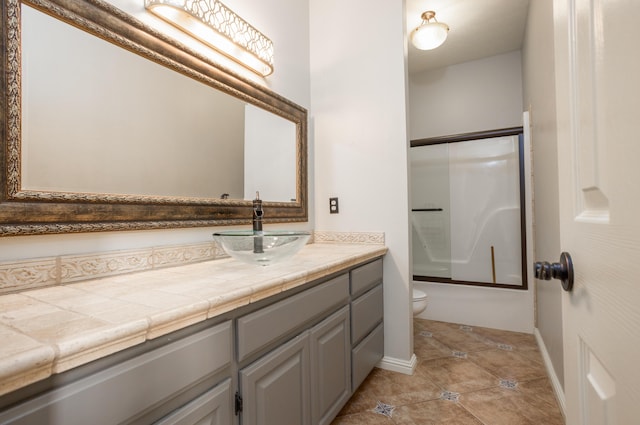 4225 E Crosswinds Pl, Springfield, MO 65809 - bathroom with vanity, shower / bath combination with glass door, and tile patterned flooring
