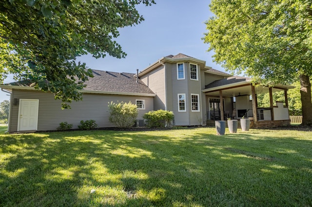 4225 E Crosswinds Pl, Springfield, MO 65809 - rear view of property with a yard, a patio, and roof with shingles