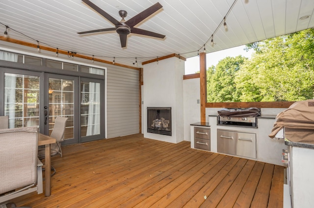 4225 E Crosswinds Pl, Springfield, MO 65809 - deck with an outdoor kitchen and a ceiling fan
