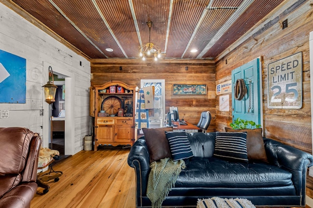 208 E Washington St, Pierce City, MO 65723 - living area featuring wood walls, hardwood / wood-style floors, and recessed lighting