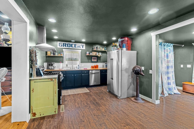 208 E Washington St, Pierce City, MO 65723 - kitchen featuring appliances with stainless steel finishes, island exhaust hood, open shelves, dark wood finished floors, and recessed lighting