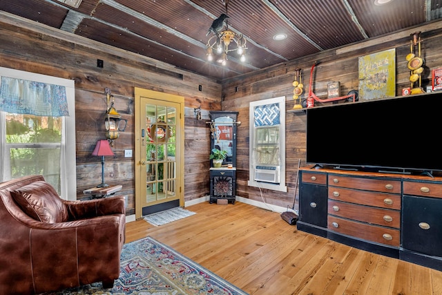 208 E Washington St, Pierce City, MO 65723 - living room with wood walls, wood finished floors, and wooden ceiling