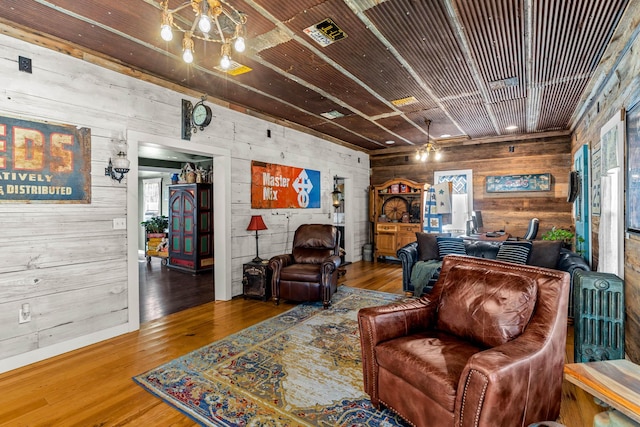 208 E Washington St, Pierce City, MO 65723 - living room with wooden walls and wood finished floors