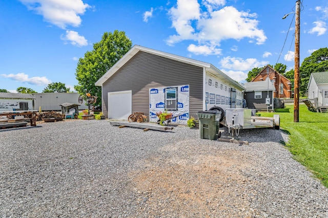 208 E Washington St, Pierce City, MO 65723 - view of side of home with a detached garage