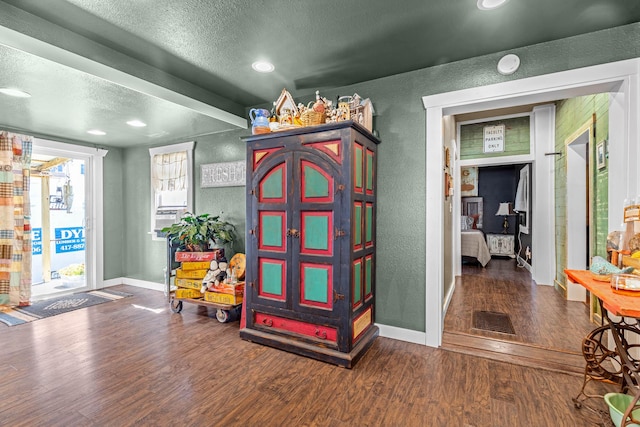 208 E Washington St, Pierce City, MO 65723 - entryway featuring a textured wall, wood finished floors, a textured ceiling, and recessed lighting