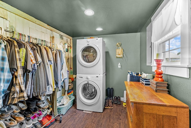 208 E Washington St, Pierce City, MO 65723 - laundry area featuring stacked washing machine and dryer, wood finished floors, and recessed lighting