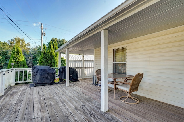1410 S Elizabeth Rd, Stockton, MO 65785 - wooden deck with area for grilling