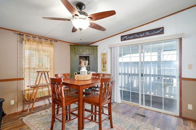 1410 S Elizabeth Rd, Stockton, MO 65785 - dining room with vaulted ceiling, crown molding, ceiling fan, and wood finished floors