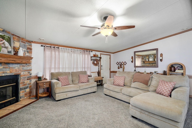 1410 S Elizabeth Rd, Stockton, MO 65785 - living room with a ceiling fan, carpet, lofted ceiling, ornamental molding, and a fireplace