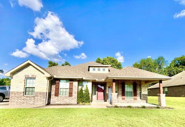 1113 Chesterfield Dr, Webb City, MO 64870 - view of front of property with brick siding, a front lawn, roof with shingles, and a porch