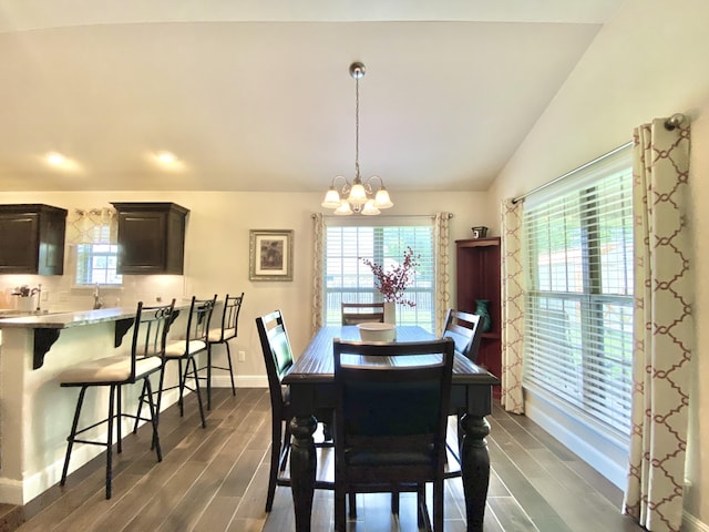 1113 Chesterfield Dr, Webb City, MO 64870 - dining room featuring vaulted ceiling, a chandelier, and dark wood-style flooring