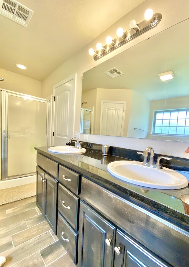 1113 Chesterfield Dr, Webb City, MO 64870 - bathroom featuring double vanity and a stall shower