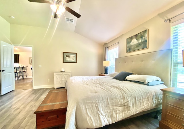 1113 Chesterfield Dr, Webb City, MO 64870 - bedroom featuring wood finished floors, lofted ceiling, multiple windows, and a ceiling fan
