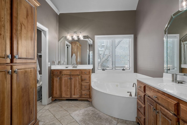 3931 E Stanford St, Springfield, MO 65809 - bathroom featuring a bath, two vanities, and tile patterned floors
