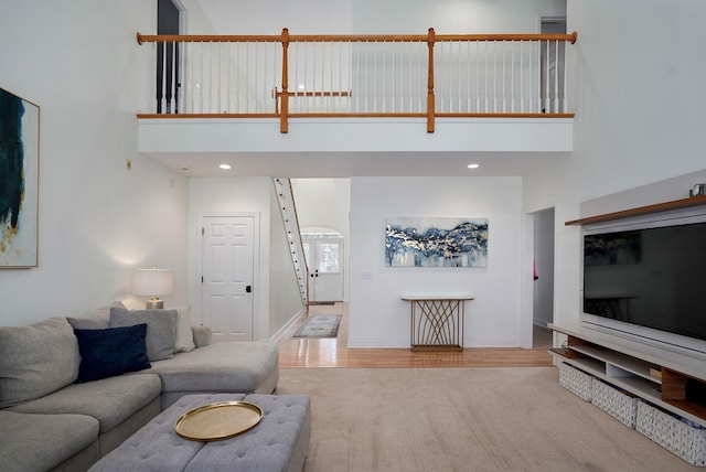 3931 E Stanford St, Springfield, MO 65809 - living area featuring a high ceiling, carpet flooring, and wood finished floors