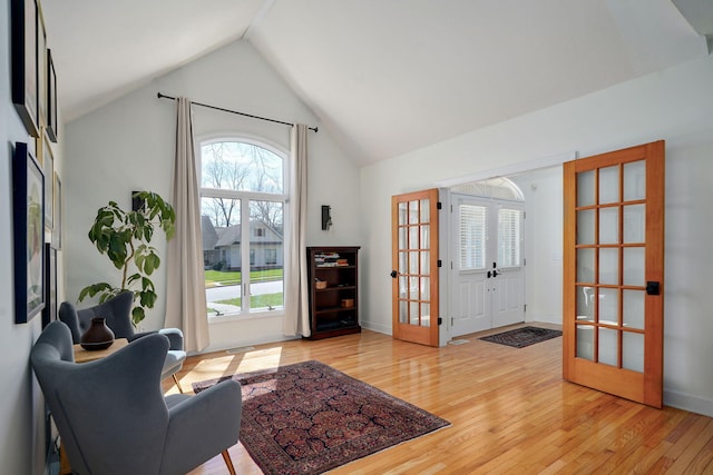 3931 E Stanford St, Springfield, MO 65809 - foyer with vaulted ceiling, light wood-style flooring, and french doors