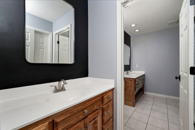 3931 E Stanford St, Springfield, MO 65809 - bathroom featuring two vanities and tile patterned flooring