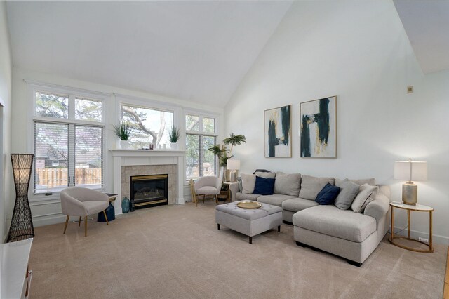 3931 E Stanford St, Springfield, MO 65809 - living area with high vaulted ceiling, a tiled fireplace, and light colored carpet