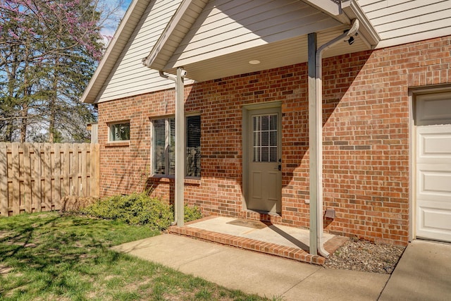 3931 E Stanford St, Springfield, MO 65809 - doorway to property featuring brick siding and a garage