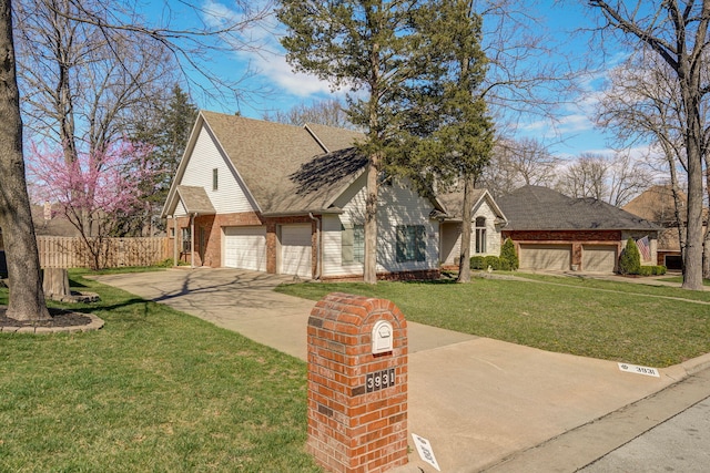 3931 E Stanford St, Springfield, MO 65809 - view of front of property featuring brick siding, driveway, a garage, and roof with shingles
