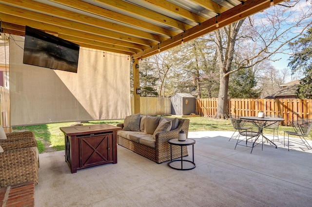 3931 E Stanford St, Springfield, MO 65809 - fenced backyard with a storage shed, outdoor dining area, a patio, and an outdoor living space