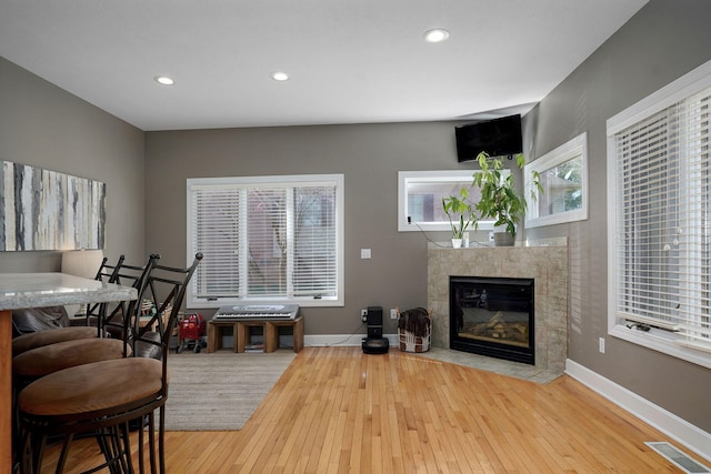 3931 E Stanford St, Springfield, MO 65809 - living room with a tile fireplace, hardwood / wood-style flooring, and recessed lighting