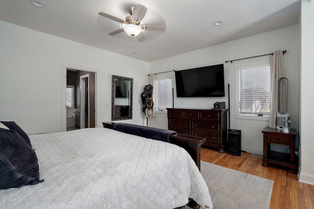 3931 E Stanford St, Springfield, MO 65809 - bedroom with light wood-type flooring, multiple windows, ceiling fan, and recessed lighting