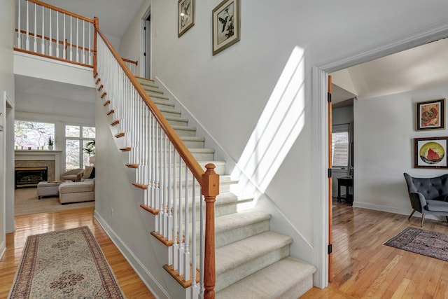 3931 E Stanford St, Springfield, MO 65809 - stairway with wood finished floors and a fireplace