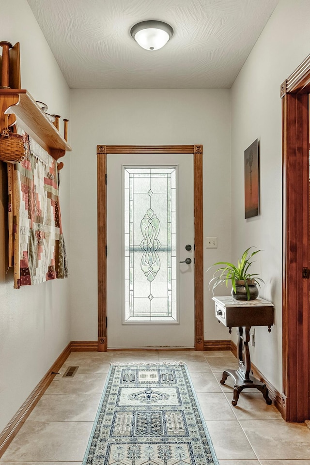 2419 W Deerbrooke Trl, Ozark, MO 65721 - foyer with light tile patterned floors and a textured ceiling