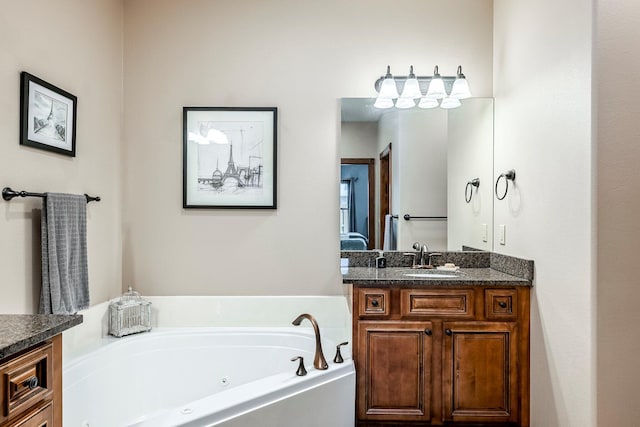 2419 W Deerbrooke Trl, Ozark, MO 65721 - bathroom featuring vanity and a tub with jets