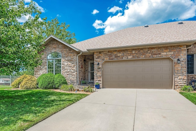 2419 W Deerbrooke Trl, Ozark, MO 65721 - ranch-style house featuring stone siding, an attached garage, and roof with shingles